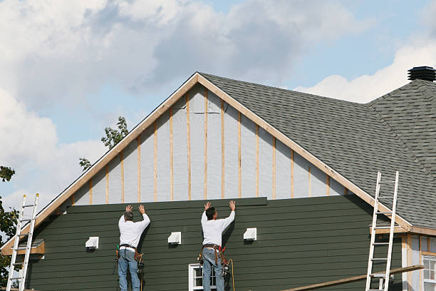 Professional Siding Repair technician working in Wellsville, PA